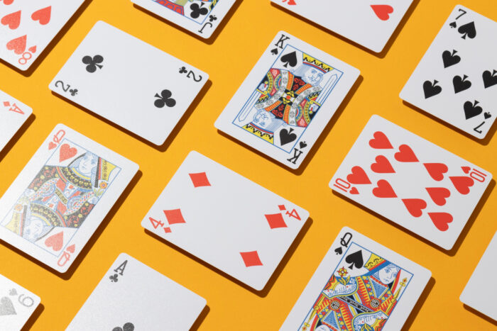 Copag_Triciclo-casino-cards-on-yellow-background